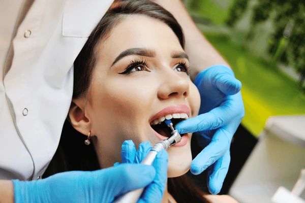 Dentist in Aubrey TX performing preventive dental care exam on a patient