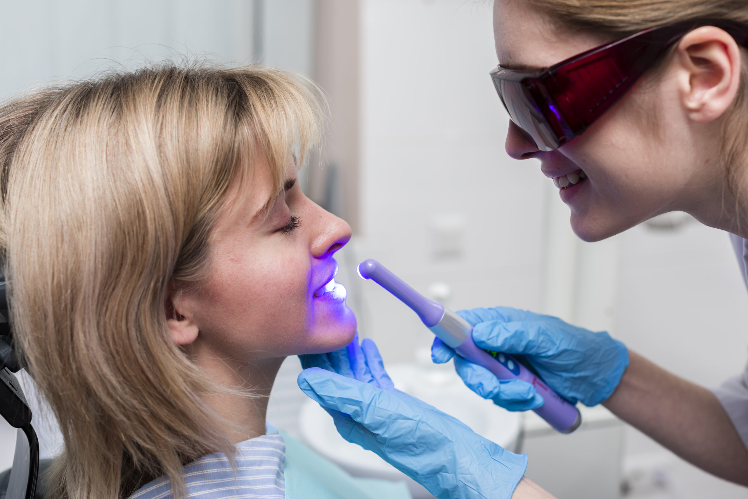 Patient receiving professional in-office teeth whitening treatment at a dentist in Aubrey TX